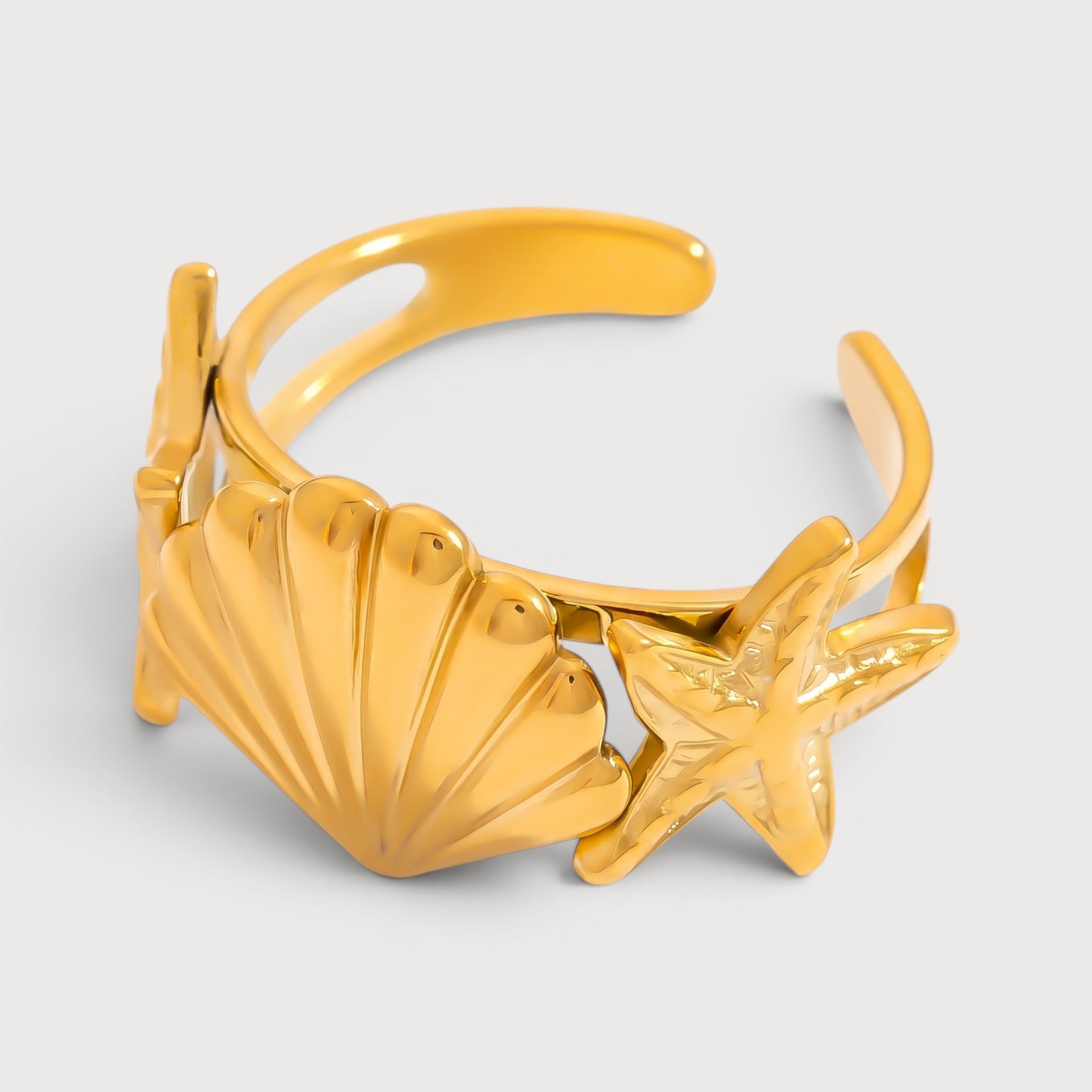 Bague coquillage cannelé et étoile de mer en acier inoxydable doré