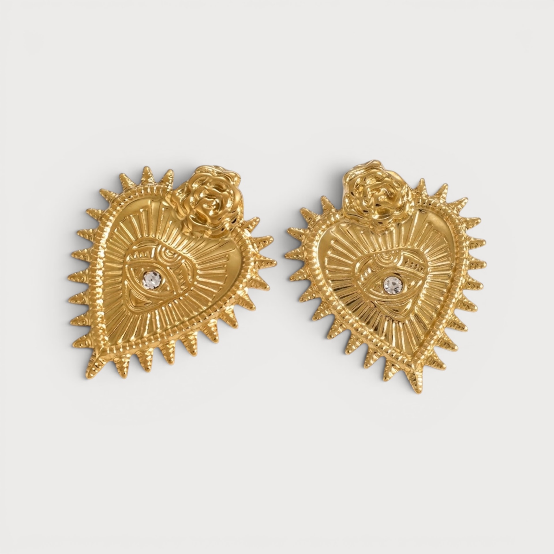 Boucles d’oreilles cœur sacré à l’œil en acier inoxydable doré