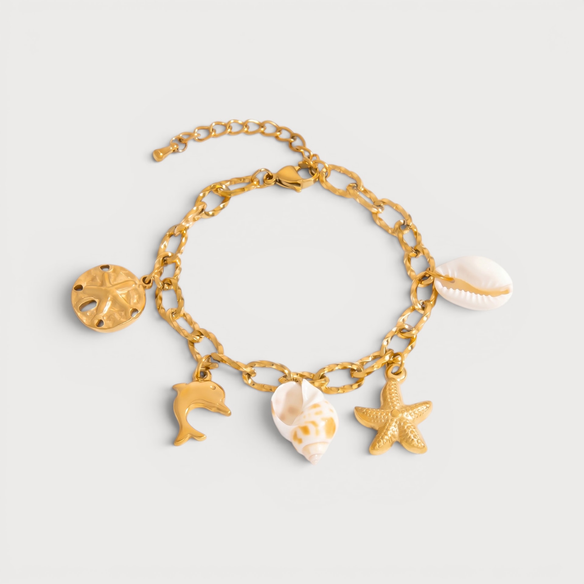 Bracelet dollar des sables, dauphin et coquillages dorés