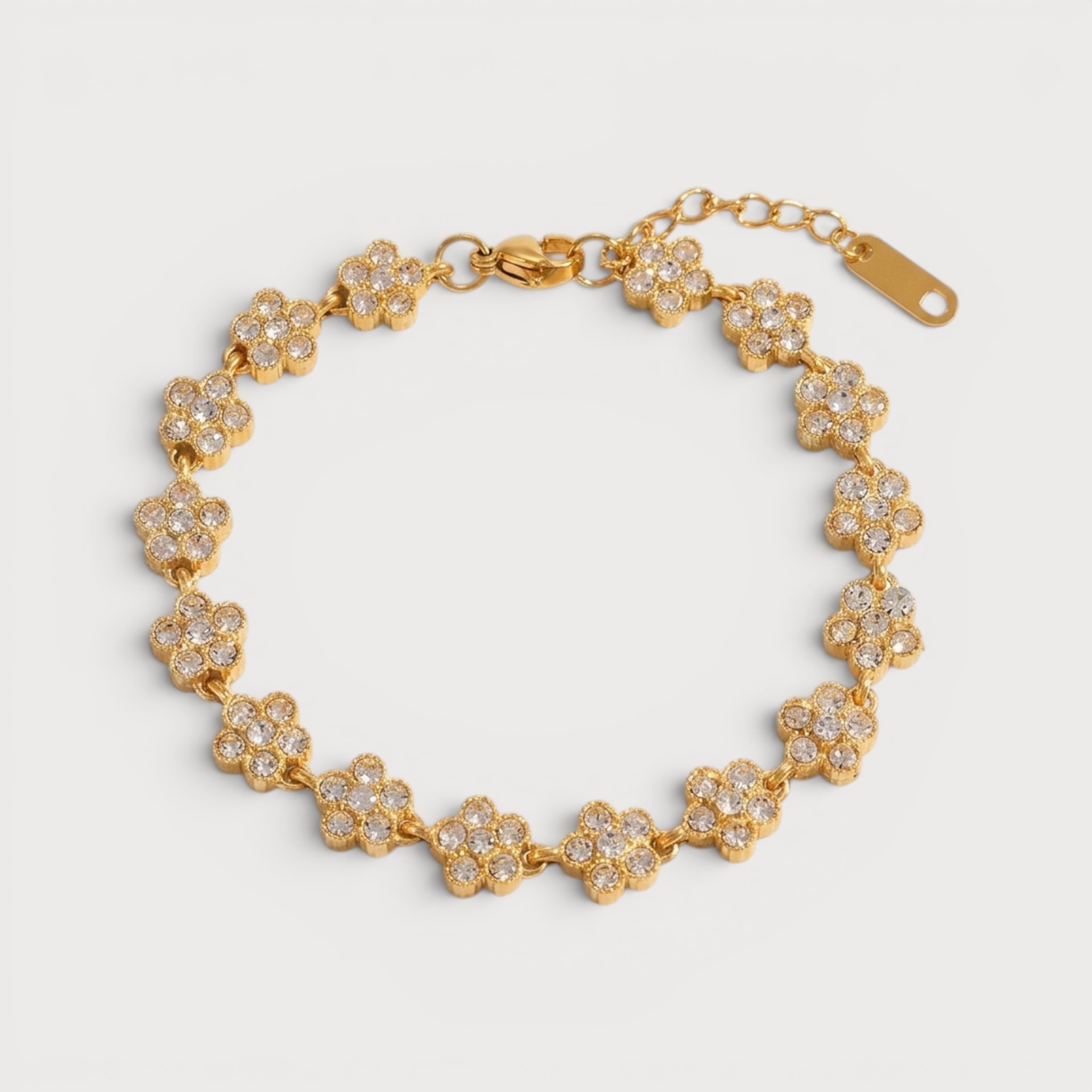 Bracelet rivière de fleurs serties en acier inoxydable doré