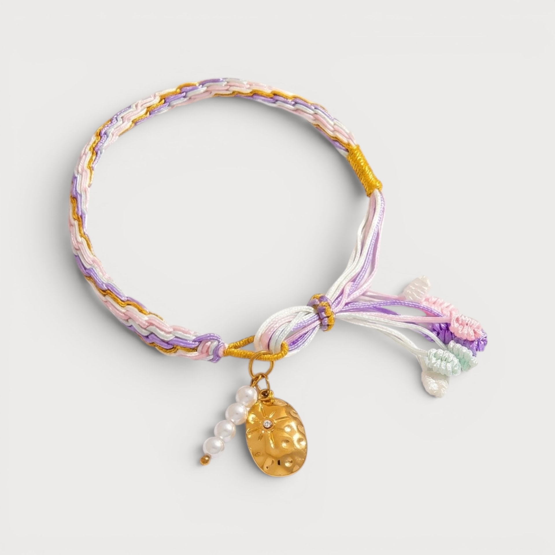 Bracelet cordon tressé pastel et charm doré étoilé