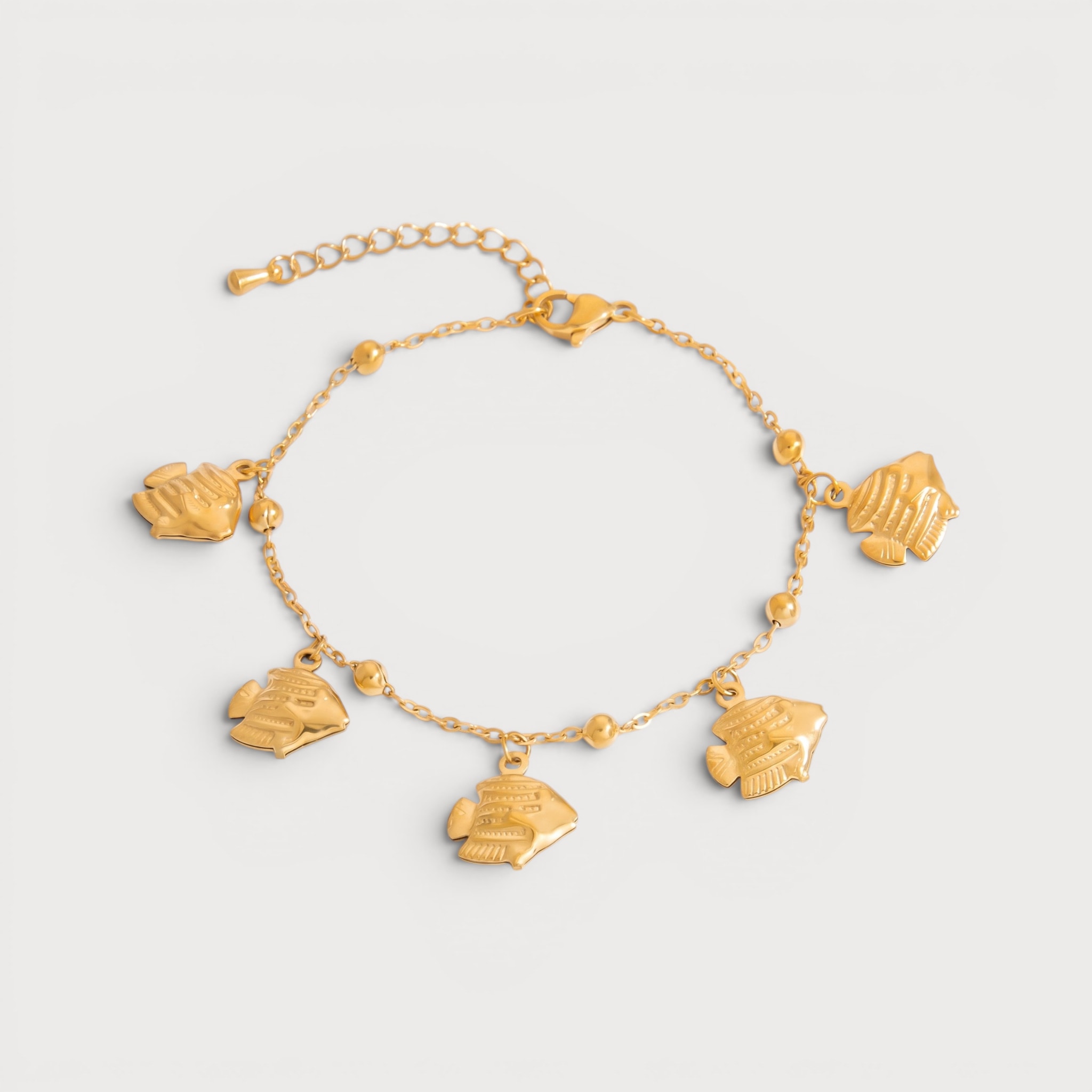 Bracelet poissons stylisés en acier inoxydable doré | Bloom × Blaze