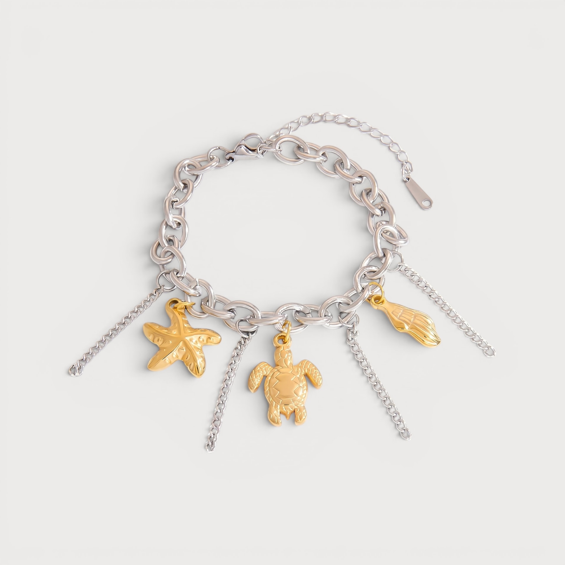 Bracelet argenté étoile de mer, tortue et coquillage dorées