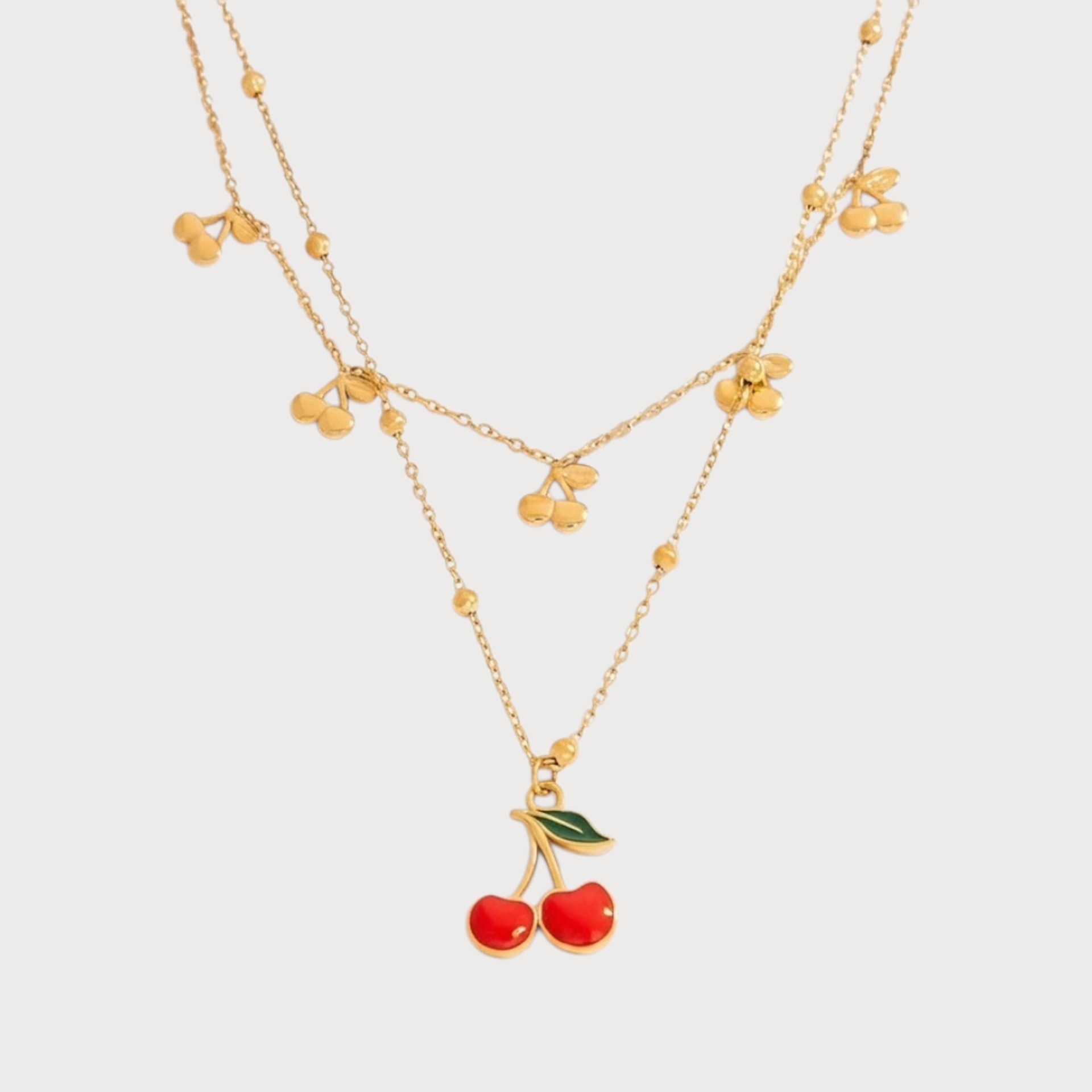 Collier double chaîne à cerises en acier inoxydable doré