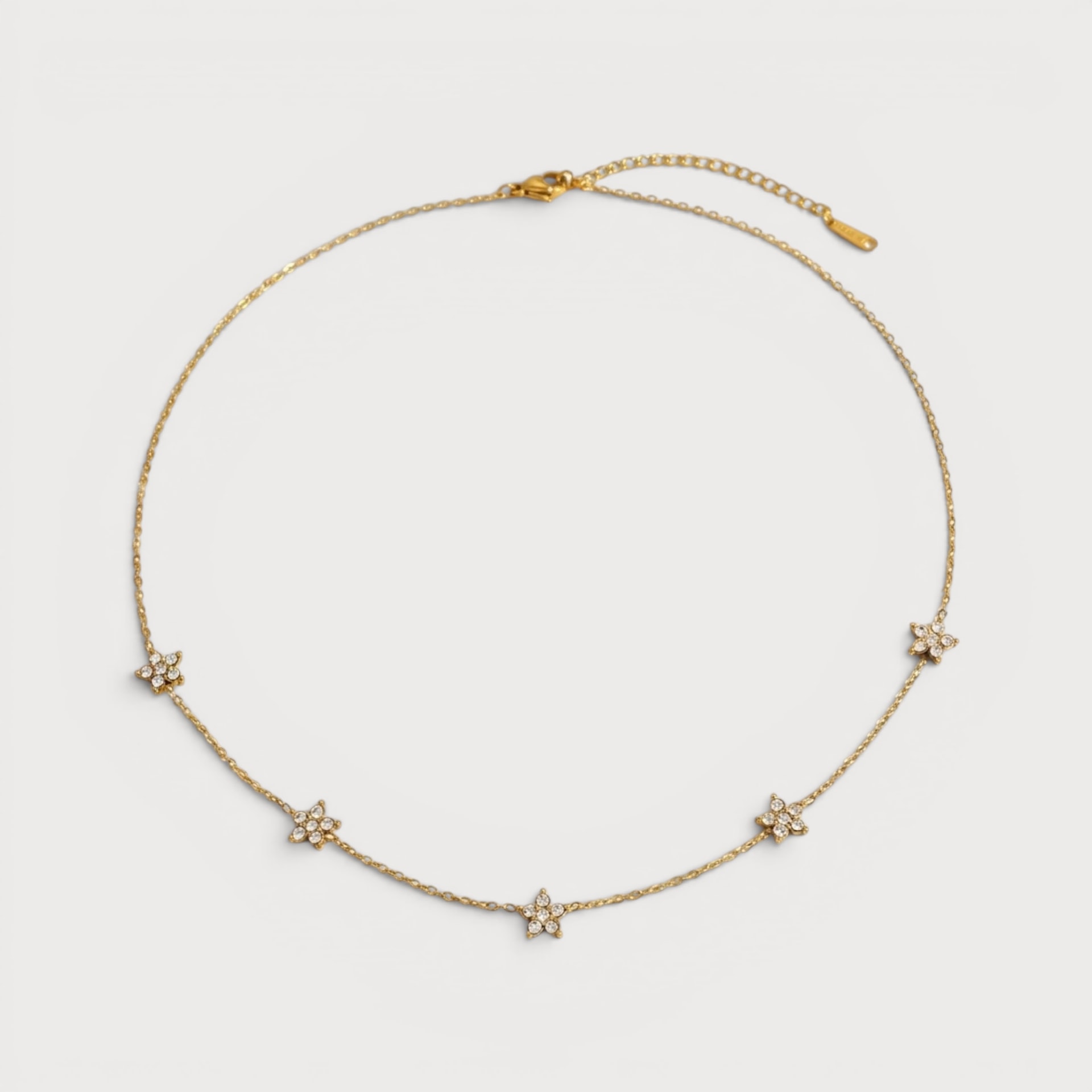 Collier fleurs étoilées serties de pierres claires en acier inoxydable