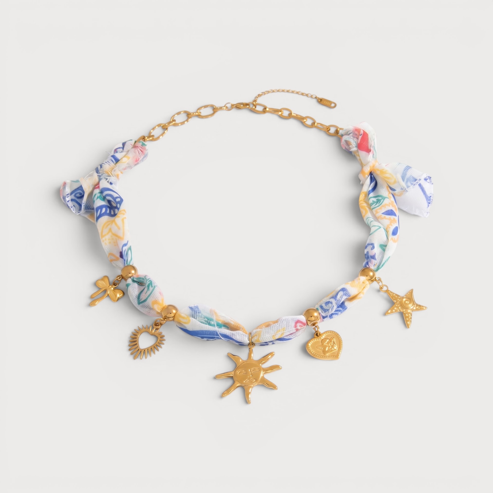 Collier bandeau imprimé, breloques dorées soleil et étoile de mer